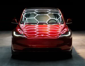 Red Tesla Model 3 Highland Front Bright